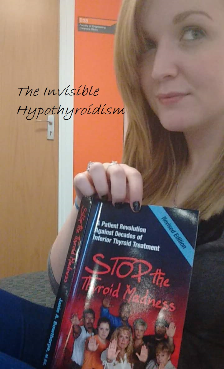 Rachel holding a copy of 'Stop the Thyroid Madness' Book