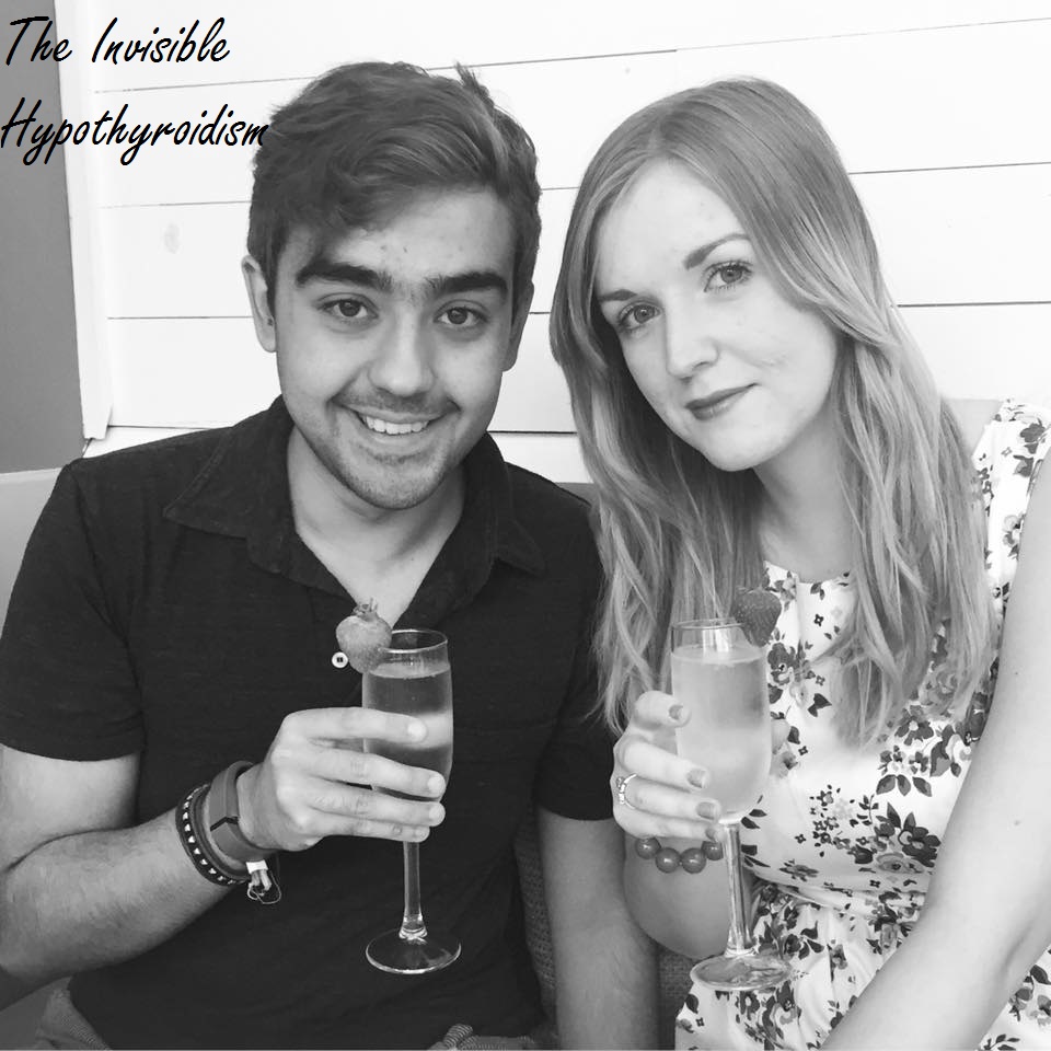 Rachel celebrating her birthday with a glass of fizz sat next to her partner Adam