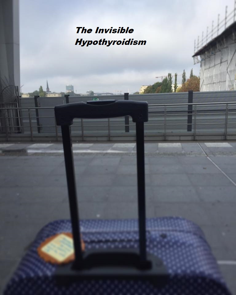 A suitcase stood on a train station platform