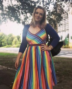 Rachel wearing a rainbow dress